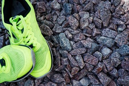 Trail running shoes in a park, close-up sneakers. Running shoes before practice. Sport active lifestyle concept. Horizontal photo banner for website header design.の写真素材