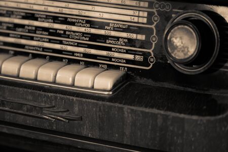 Vintage style radio in wooden box and fabric front.の写真素材