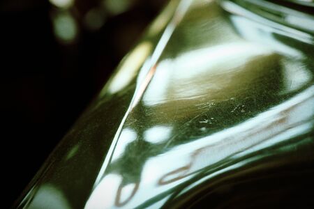 Polished car body with light reflection, sunny bunny on old vintage car, business consept.の写真素材