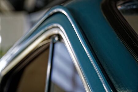 Polished car body with light reflection, sunny bunny on old vintage car, business consept.の写真素材