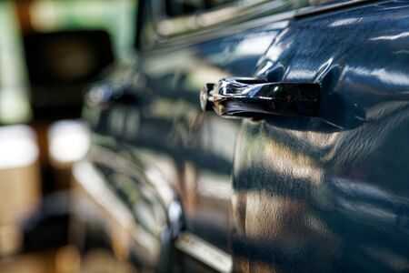 Edge door of car Door handle of retro classic car, Vintage tone.の写真素材