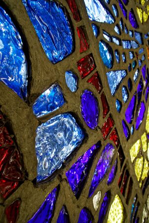 Glass mosaic from different pieces with colorful lights.の写真素材