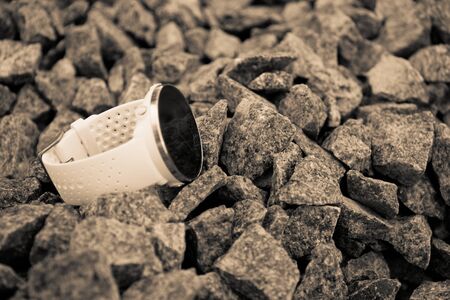 Sport watch for triathlon on the granite gravel. Smart watch for tracking daily activity and strength trainingの写真素材