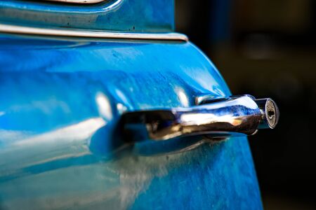 Edge door of car Door handle of retro classic car, Vintage tone.の写真素材