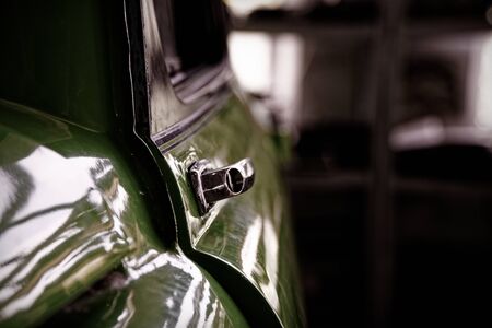 Edge door of car Door handle of retro classic car, Vintage tone.の写真素材