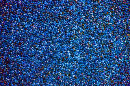 Blue atoll pebbles create nice pattern, gravel texture.の写真素材