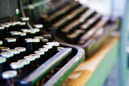 Old typewriter in antique photography vintage simulated, grunge photo.の写真素材