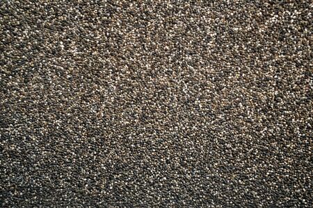 Small brown pebbles create nice pattern, gravel texture.の写真素材