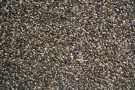 Small brown pebbles create nice pattern, gravel texture.の写真素材