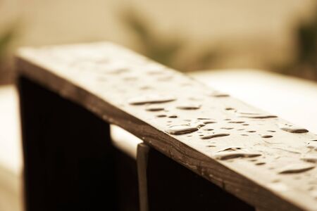 Drops of water on the wooden surface - handrail chair.の写真素材