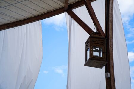 Wooden retro and vintage lantern or classic lamp for interior or exterior architecture and decor at home and cafe or hotel and resort.の写真素材