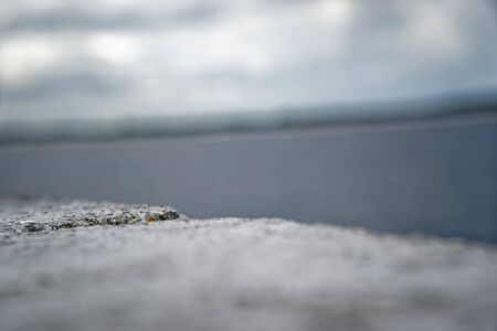 Pier against cloudy sky, overcast, defocused backgroundの写真素材