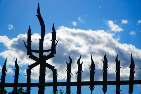 Weathered metal post finials Trident metal fence for protection against chimeras and evil powerの写真素材