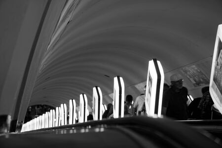 Kyiv, Ukraine, July 6, 2019: Passengers on traveling escalator in Kiev metro station, Ukraine.のeditorial素材