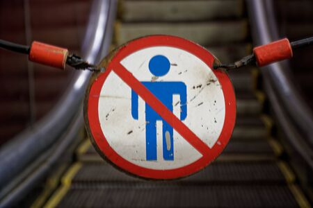 Do not enter - no trespassing sign on chains at railway station, soft focus.の写真素材