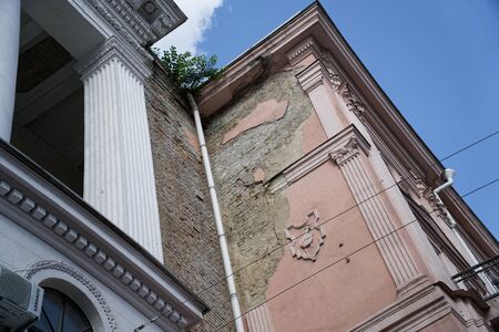Angle of antique building. Architecture large building of antique roman style with pillars and blue sky.の写真素材