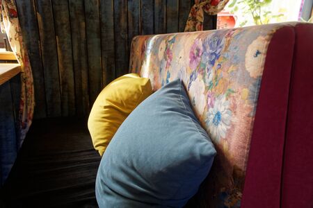 Colorful interior pillow, interior in modern cozy cafe.の写真素材