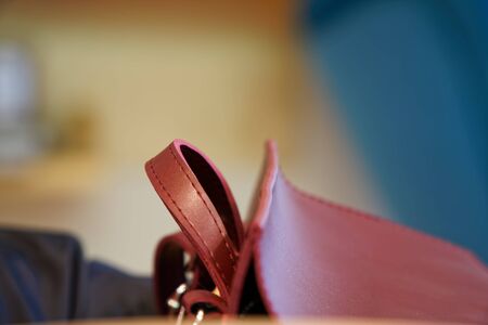 Fashionable beautiful part of leather red backpack. Warm color. Close upの写真素材