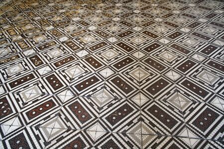 Old checkered floor. Decorative ornamental checkered marble floor.