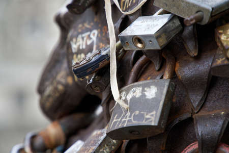 Love padlocks at rusty statue of bronze lion.のeditorial素材
