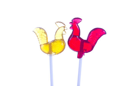 Sugar cockerel on stick isolated on whiteの写真素材