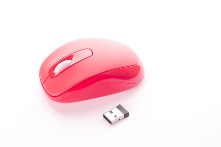 Red cordless mouse for PC and usb connector, isolated on whiteの写真素材