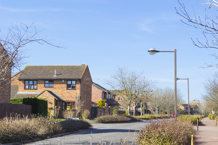 MILTON KEYNES, ENGLAND - MARCH 03, 2015: Sunny view at streets and residential buildings of Two Mile Ash district in spring day, United Kingdom.のeditorial素材