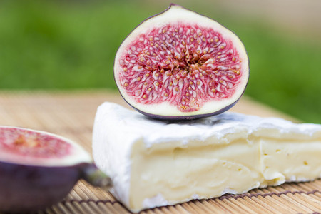 White wine, brie cheese and figs (shallow depth of field)の写真素材