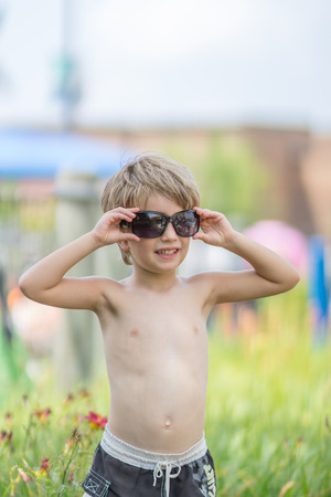 Portrait of  a boy with sunglassesの写真素材