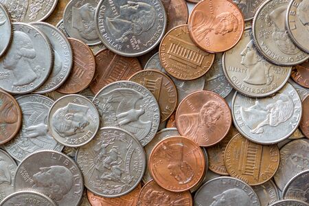 Close-up of a one cent, 10 cent and a quarter coinsの写真素材
