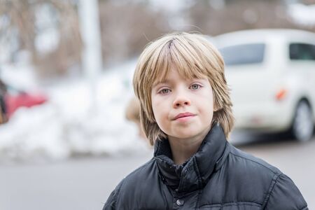 Portrait of a  boy with a blurred backgroundの写真素材