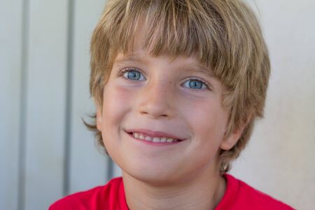 Portrait of a smiling boy with a blurred backgroundの写真素材