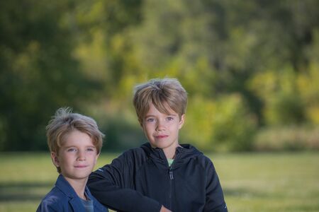 Portrait of two boys with a blurred backgroundの写真素材