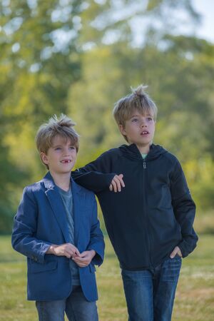 Portrait of two boys with a blurred backgroundの写真素材
