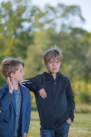 Portrait of two boys with a blurred backgroundの写真素材