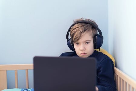 Kid studying from home amid COVID-19 coronavirus crisis