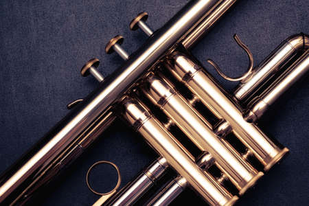 Close up of the valves of a trumpet on a black background. Details of a trumpetの写真素材