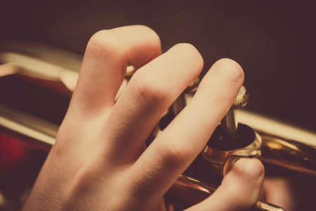 Close up of a child playing a trumpetの写真素材