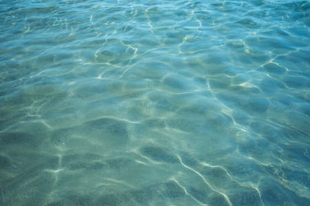 Background shot of aqua sea water surfaceの写真素材