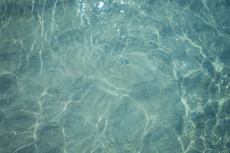Background shot of aqua sea water surfaceの写真素材