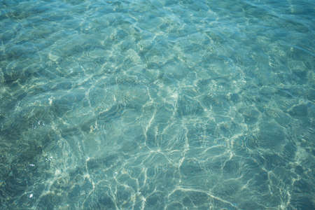 Background shot of aqua sea water surfaceの写真素材