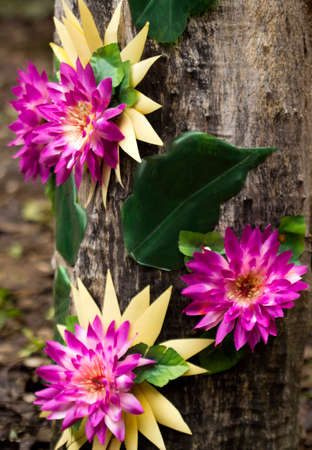 Artificial flower with tree background.の写真素材
