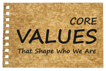 CORE VALUES written on brown of recycled paper on white background. That Shape Who We Are? Business concept. の写真素材