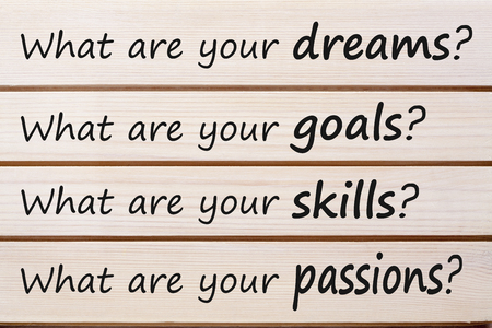 What are your dreams, goals,skills, and passions? written on wood wall decor. Business Concept. の写真素材