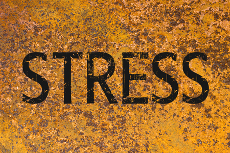 Stress written on metal corroded texture. Stress concept.の写真素材