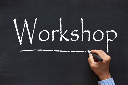 Handwriting Workshop with chalk marker on blackboard. Business Concept.の写真素材