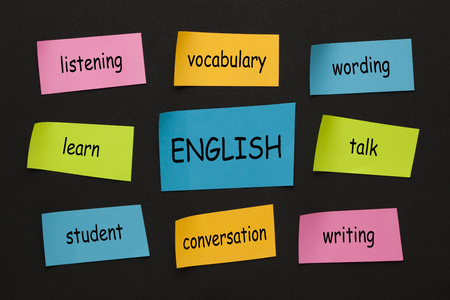 English mind map with colorful stickers on black background. Learning languages conceptの写真素材