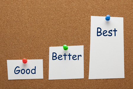 Good Better Best on paper sheet  with pin in the shape of a staircase on cork board. Business concept.の写真素材