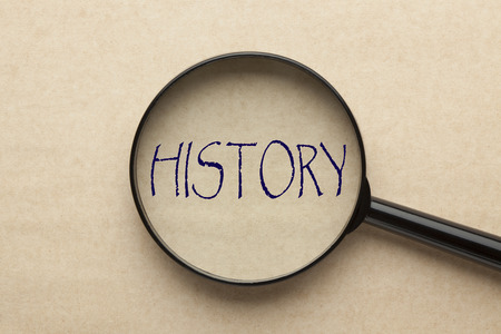 Magnifying glass focusing on HISTORY word. Business conceptの写真素材