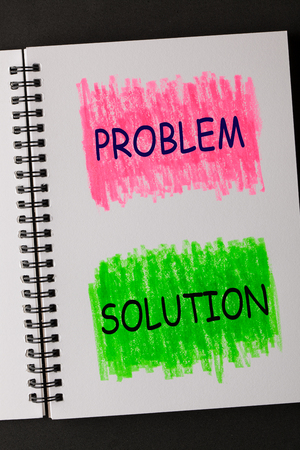 Problem and Solution on painted sketchbook in red and green. Business concept.の写真素材